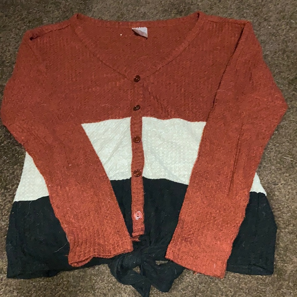 Long sleeve burnt orange, cream, and black color